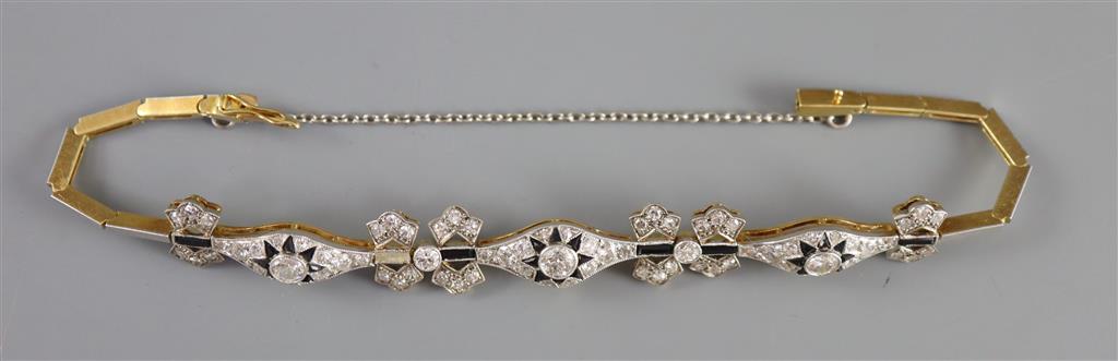 A 1920s gold and platinum, diamond and black onyx set bracelet, approx. 16cm,